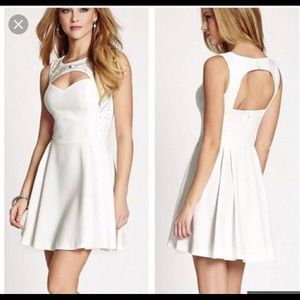 Sexy little white dress with jewels. Guess.